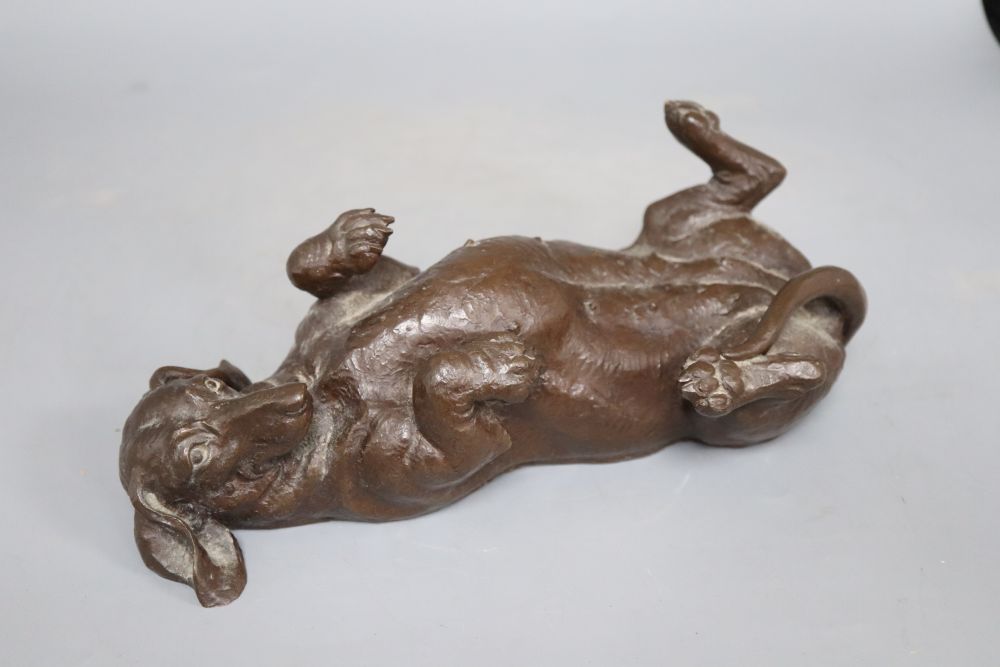 A composite figure of a recumbent dachshund, signed Doris Lindner, length 26cm